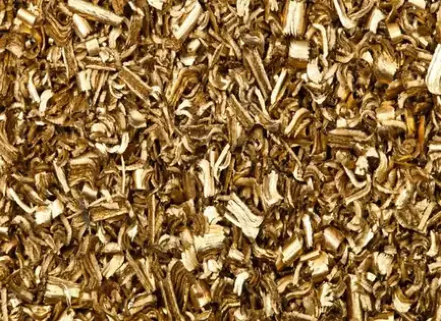 Brass swarf shavings and curled chips from machining operations