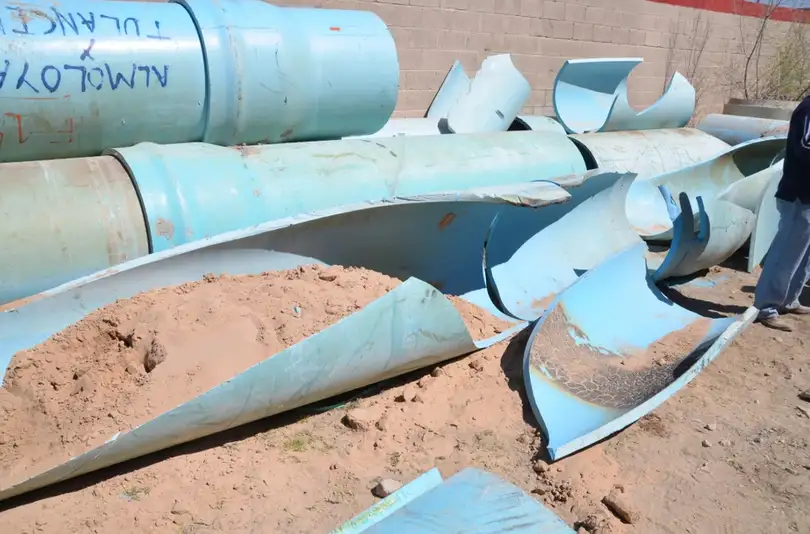 Brittle cracked PVC pipes showing material failure and degradation