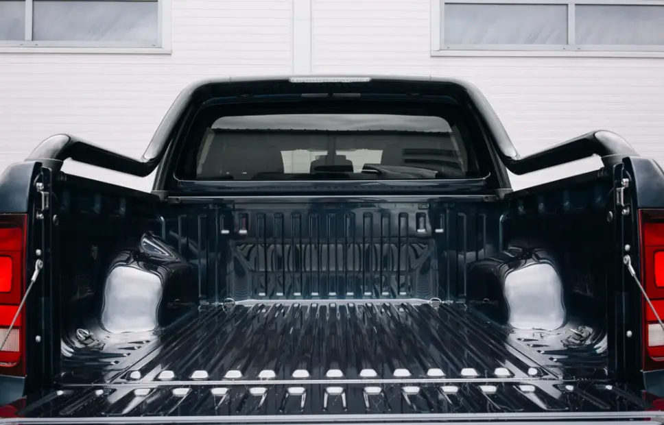 Black thermoset composite truck bed liner showing rigid, durable surface resistant to heat and chemical damage