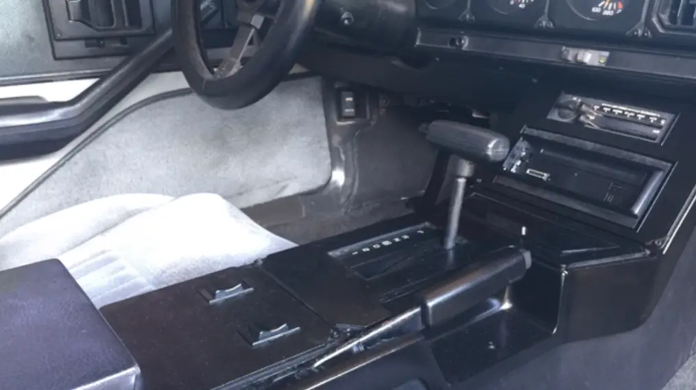 Is ABS plastic strong? Black ABS plastic dashboard, center console, and trim components in a car interior, proving the strength of this plastic