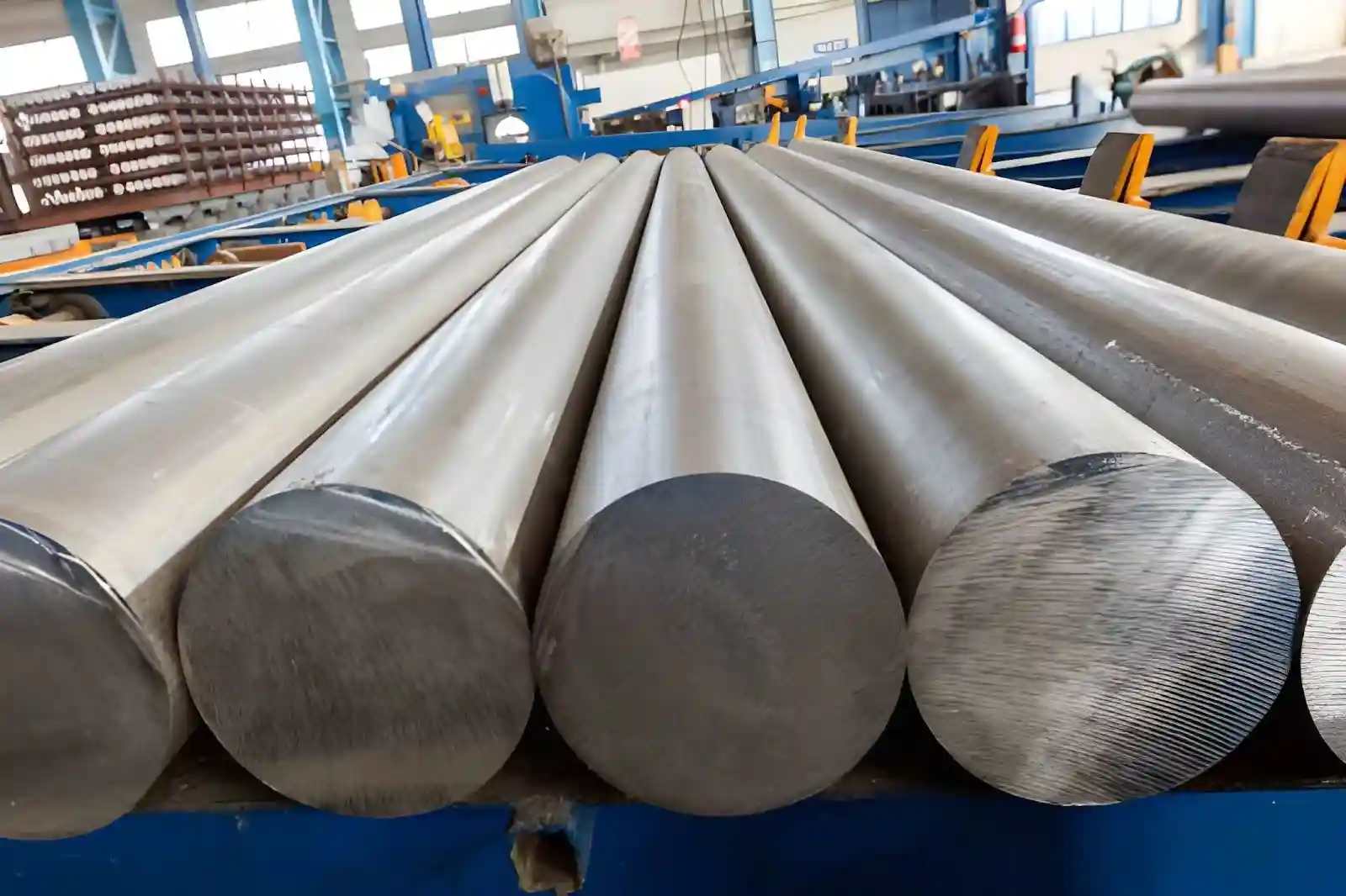 Bundles of extruded aluminium 6061 round bar stacked in a warehouse