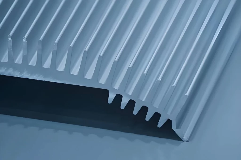 CNC-machined aluminum heat sink with visible fins for thermal dissipation.