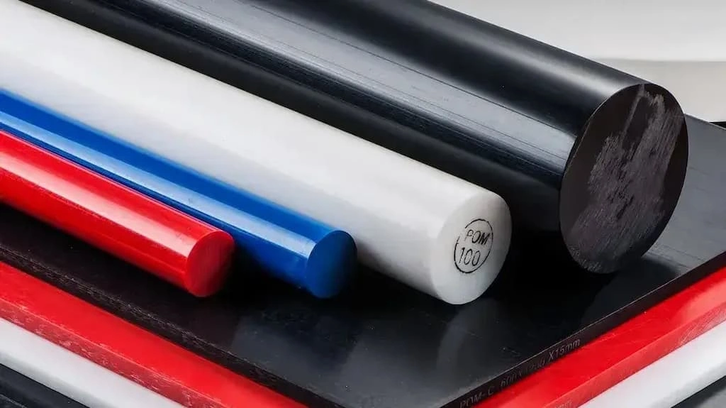 An image containing different sizes of raw Delrin rods and sheets