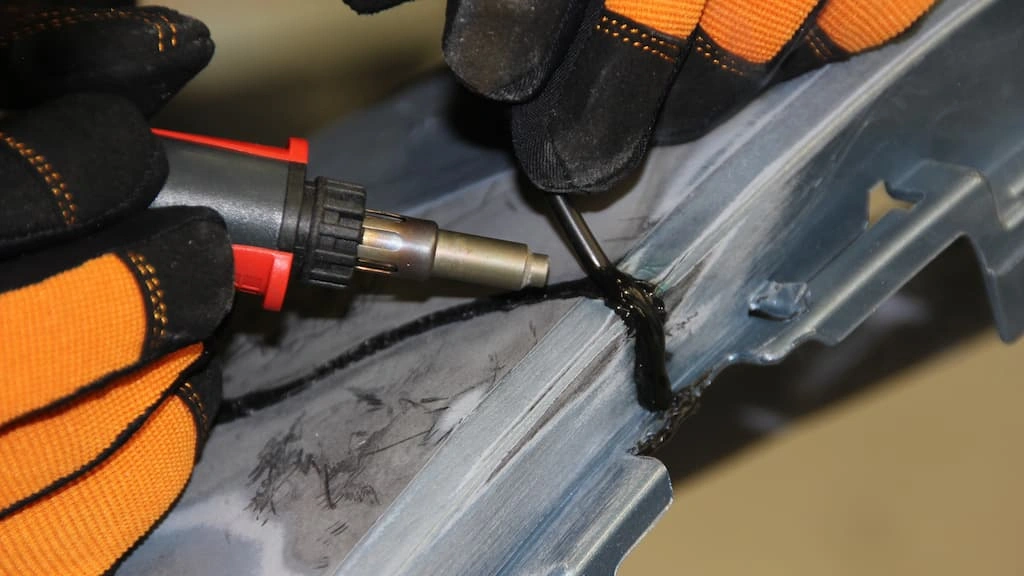 A close-up view of an operator performing plastic welding