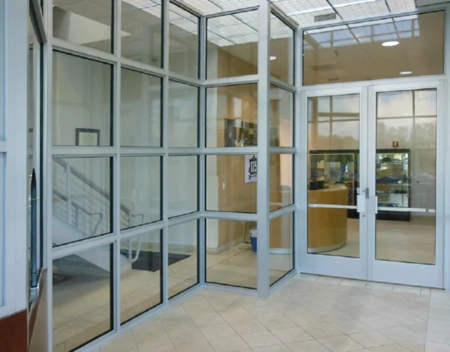 Bulletproof polycarbonate glass doors and windows in a commercial building entrance