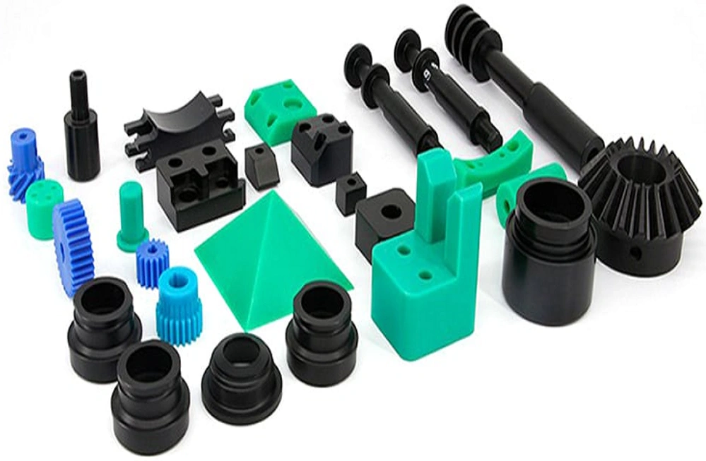 Assortment of nylon mechanical parts, including gears, brackets, and connectors, in green, blue, and black