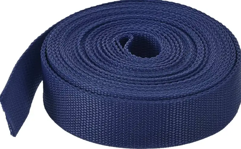 Blue polypropylene webbing strap coiled for outdoor camping and gear securing applications
