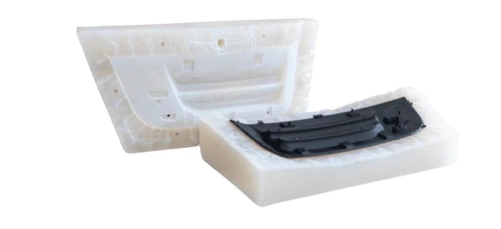 An image showing the opened silicone mold with a cast plastic part