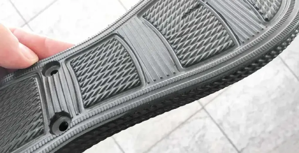 EVA foam shoe sole with multi-textured tread pattern