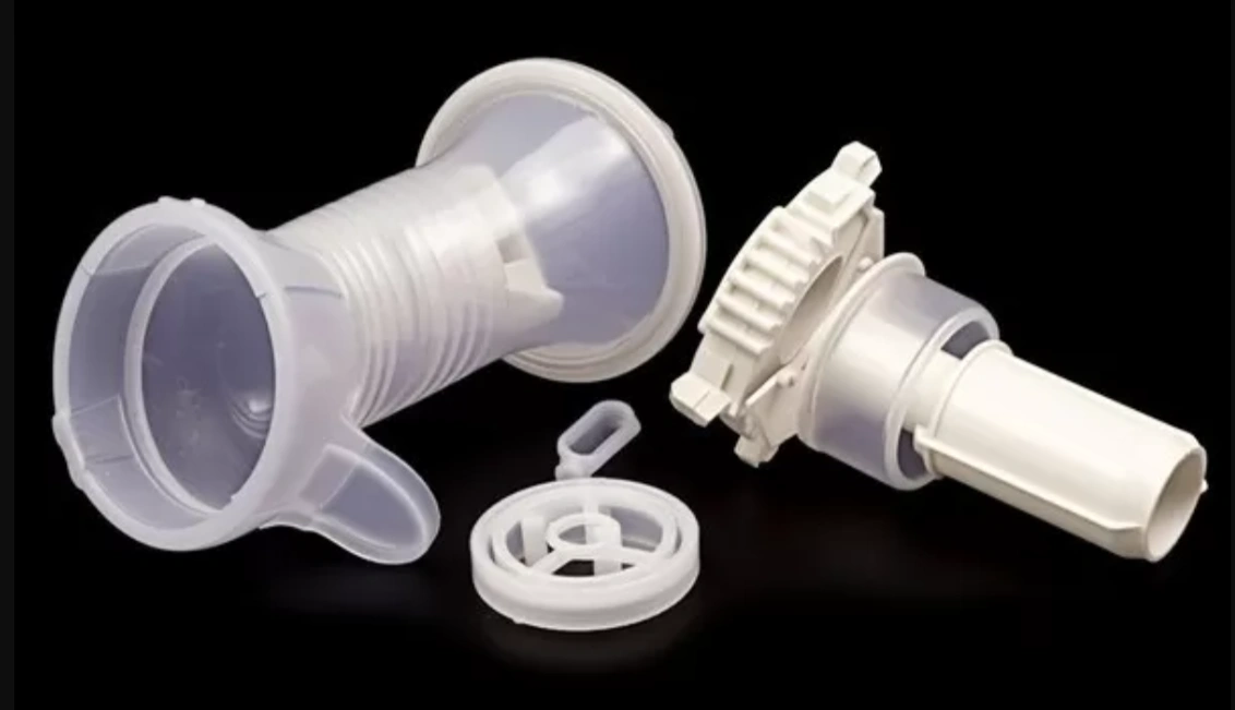TPE injection molded medical nebulizer components, including translucent mask, valve chamber, and mouthpiece assembly parts