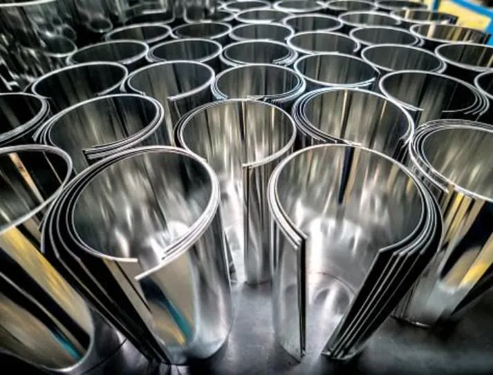 bulk of sheet metal rolls lying concentrically with each other on a table