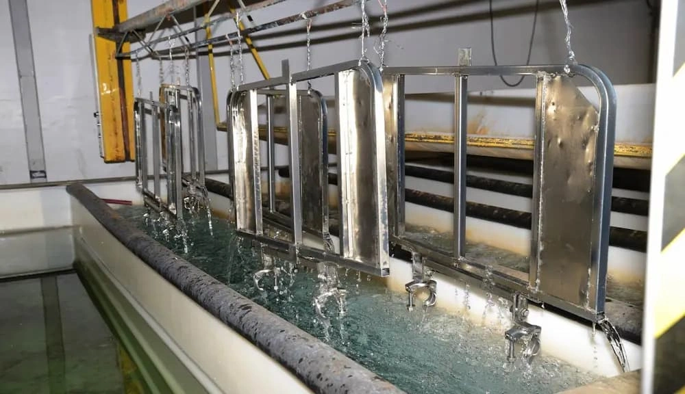 A close-up view of the Cadmium plating process; parts are ready for immersion into the electrolytic batch 