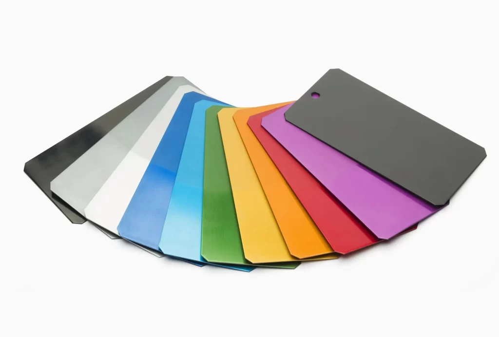 The image shows customized anodized aluminum parts in different colors.