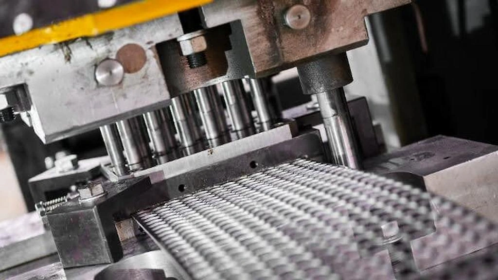  A close-up view of a progressive die stamping setup with continuous feeding 