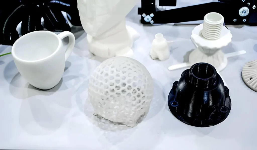 A close-up of prototype objects printed on 3d printer from plastic filament.