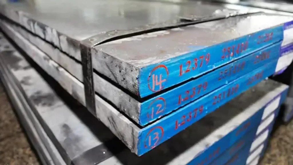 Stack of AISI D2 steel sheets showing blue front surface and numbers