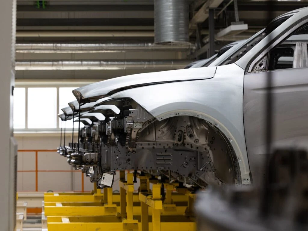 Car bodies in a workshop for automotive parts assembly
