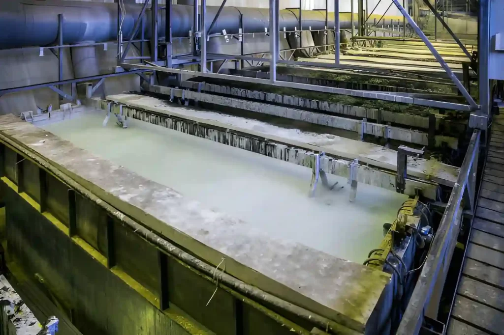 Image of a bath tank containing chemicals used for chemical conversion coating of metal parts.