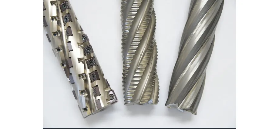 Three specialized end mills, including indexable, roughing, and finishing types, used for carbon steel machining operations.