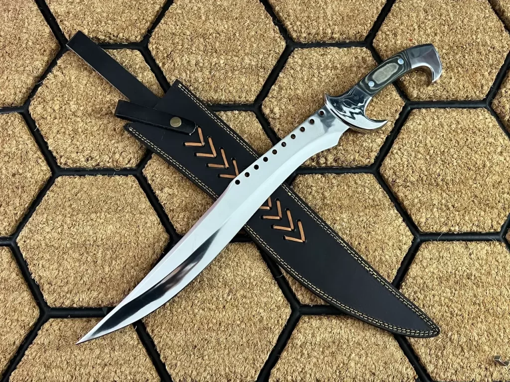 D2 steel knife with leather sheath is shown.