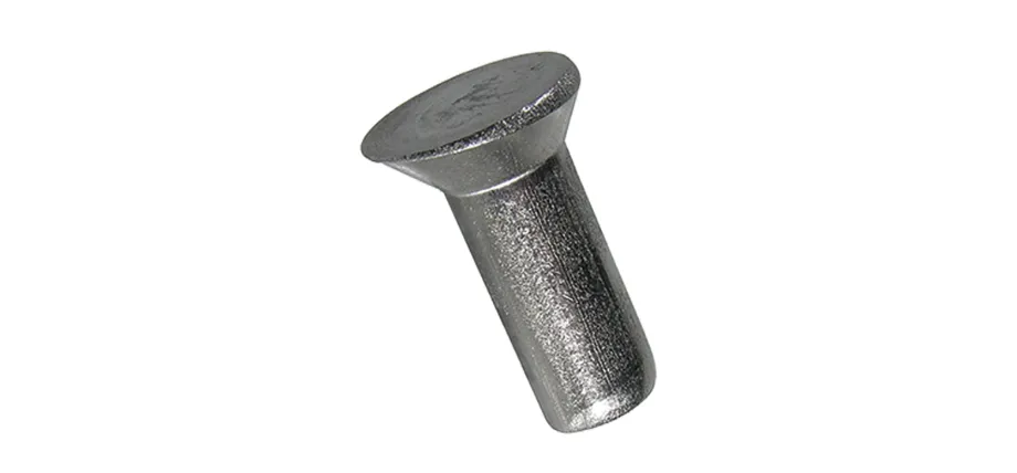 Close-up of a solid rivet featuring a flat conical countersunk head