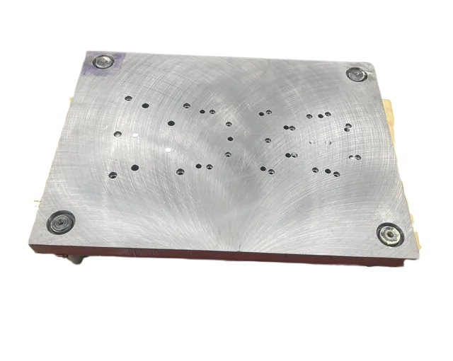 An image showing Blanchard grinding stainless steel plates with a cross-hatch pattern