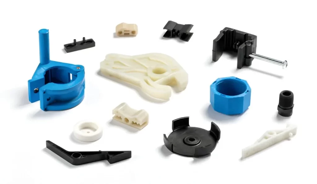 Several HDPE aerospace parts are laid out on a table. They show lightweight, tough pieces used in making aircraft parts.