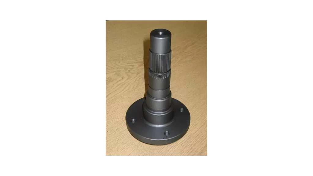 The image shows a machined metal part with a manganese phosphate coating