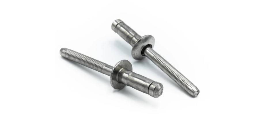 Two stainless steel blind (pop) rivets with mandrels still intact, shown before installation against a white background.