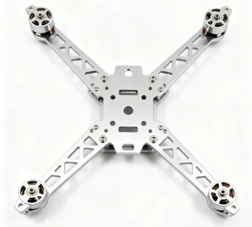 Anodized aluminum quadcopter drone frame with lightweight lattice arms and four brushless motors on a white background