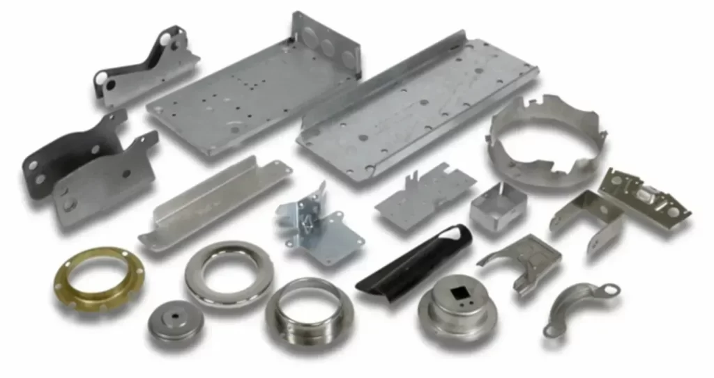 various sheet metal automotive parts and brackets on a white background