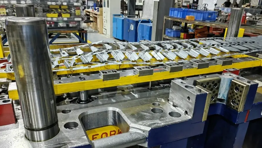 A transfer die stamping system with aluminum components
