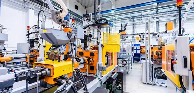 large machinery for injection molding in a working area