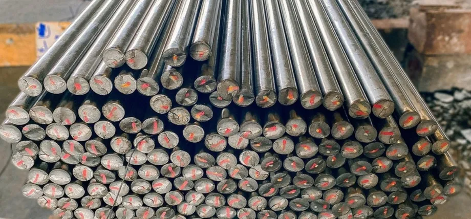 A dense bundle of thin, shiny aluminum rods with visible red markings on their circular cut ends.