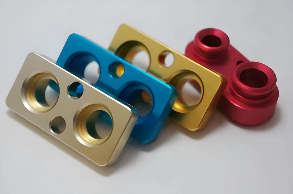 Identical aluminium parts with a smooth anodised finish, neatly arranged.