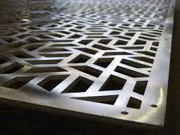 Intricate geometric metal sheet cut with CNC laser technology.