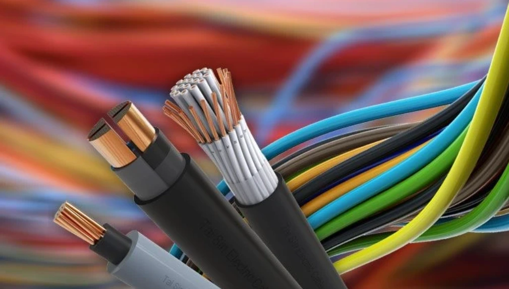 Cross-sections of COPE-insulated electrical cables revealing copper conductors, alongside multicolored wire bundles.