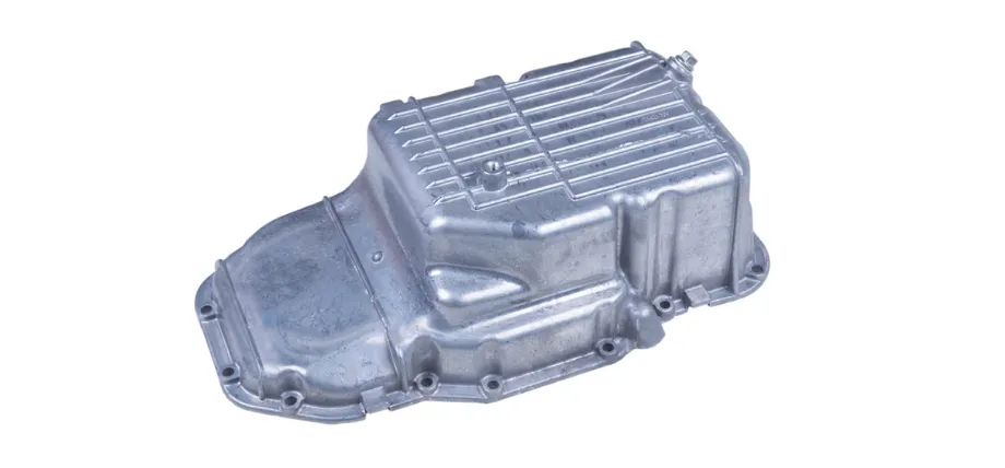 A single, clean cast aluminum automotive oil pan isolated against a white background.