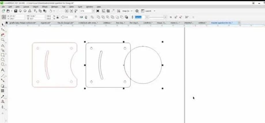 CorelDRAW workspace showing pink vector outlines of bracket-like parts with holes and arcs.