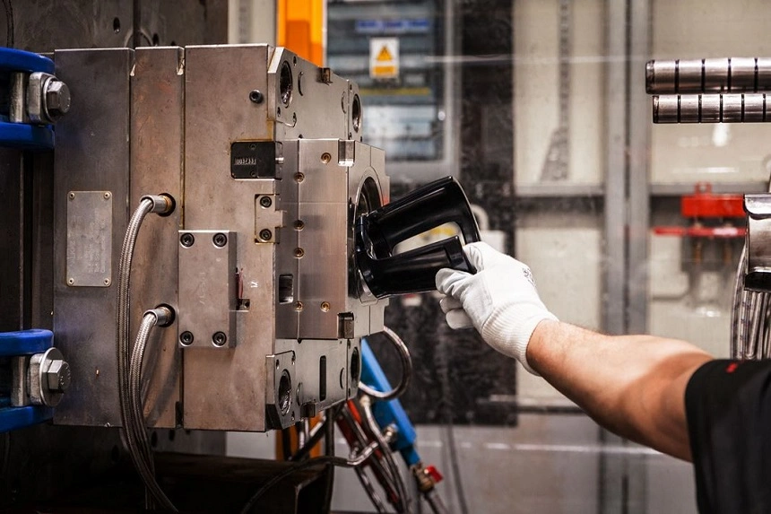 A close-up view of ejecting the PVC part from the injection mold