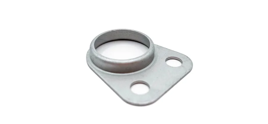 A small, flat metal flange with a circular raised neck and two mounting holes, featuring a matte grey anti-corrosive finish.