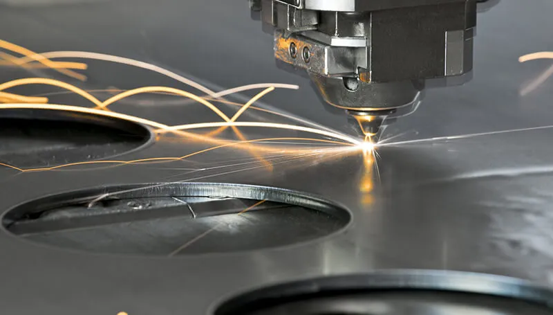 industrial laser cutting machines creating precision cuts and curved patterns in sheet metal prototyping