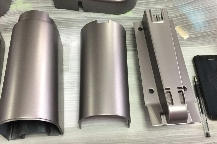Three finished metal prototypes on the table