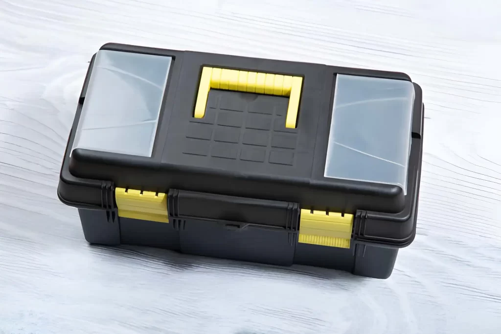 A portable black toolbox designed for handheld use.
