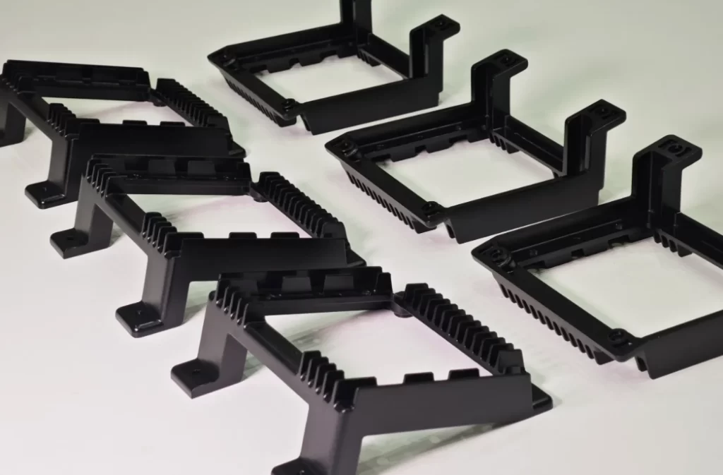 Black anodized aluminum bracket components with finned heat sink design