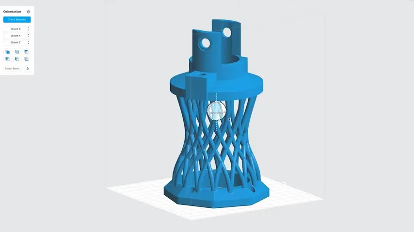 3D printing software is being used to print a bright blue prototype pattern with a complex lattice structure.