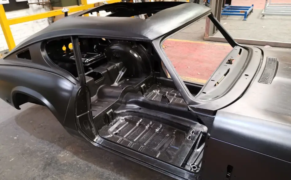 E-coated vehicle body shell, hatch open, primer finish