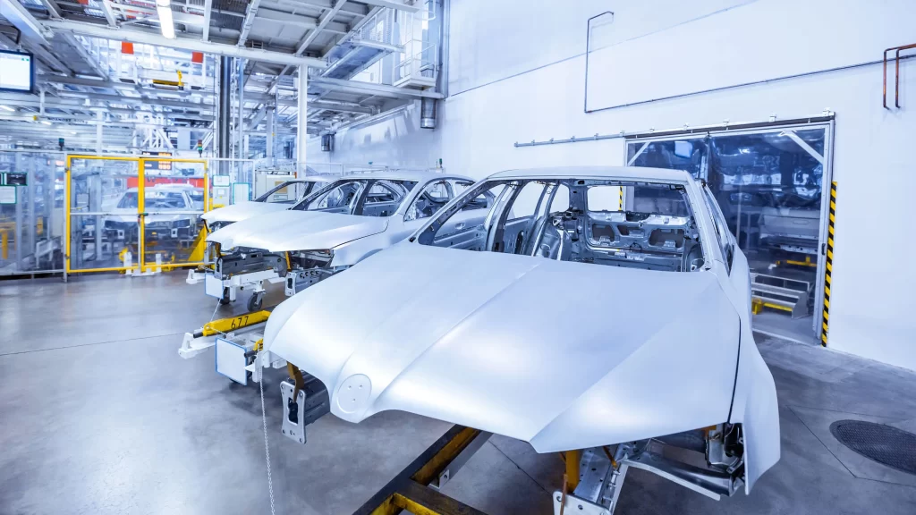 An electric vehicle in the manufacturing process in a factory