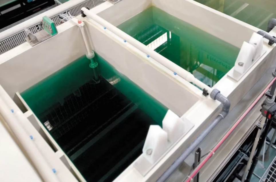 Twin nickel plating bath tanks with green solution and racking system