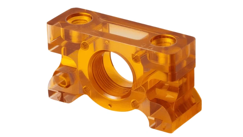 A CNC-milled PEI (Ultem) part in translucent amber color